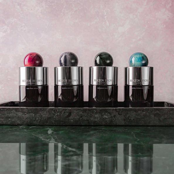 An Image of Four Bottles of Eau De Parfum