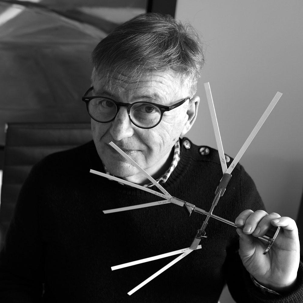 An image of Jacques Chabert holding Fragrance Sticks To his nose