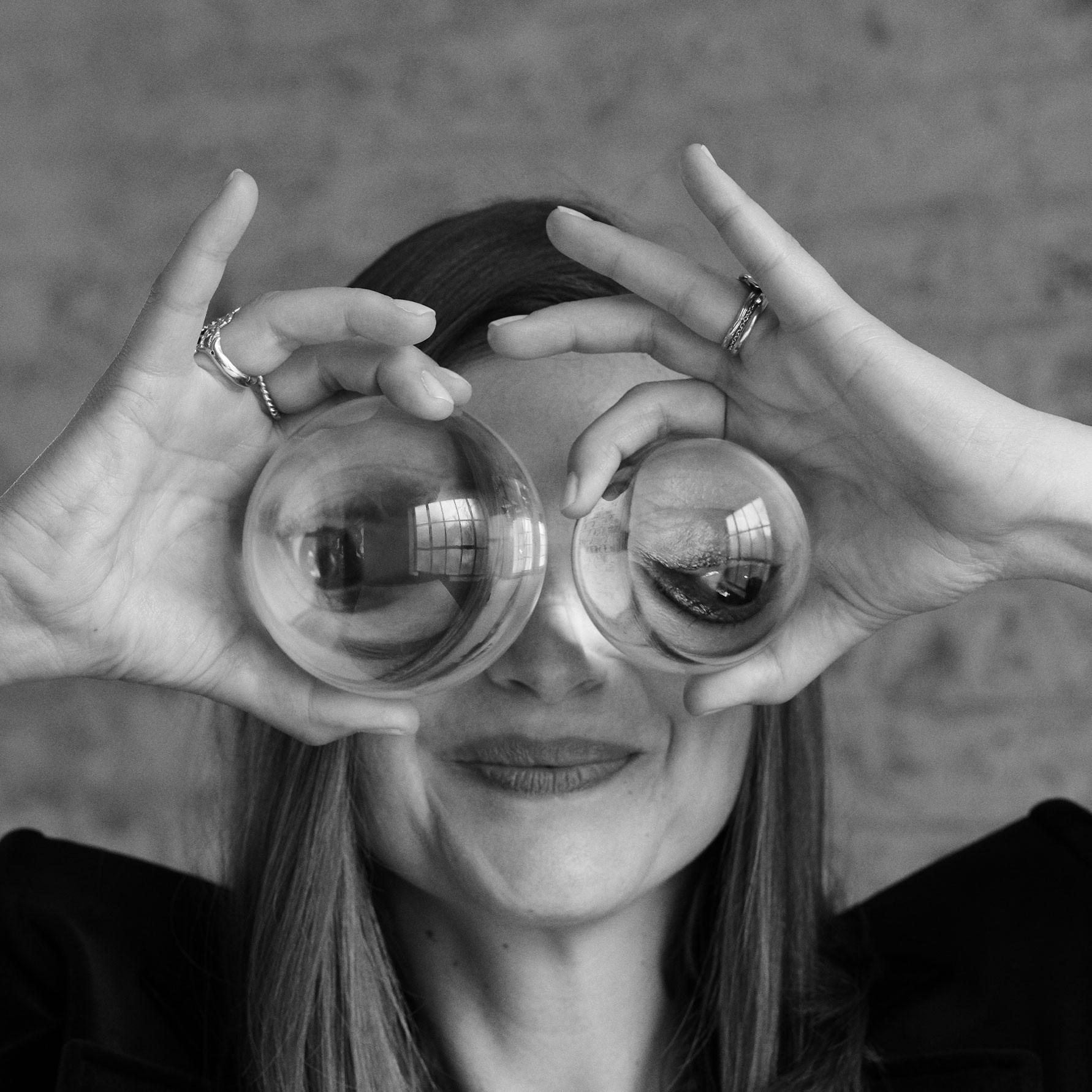 Image of Carla Chabert holding two Fragrance Glass Cylinders