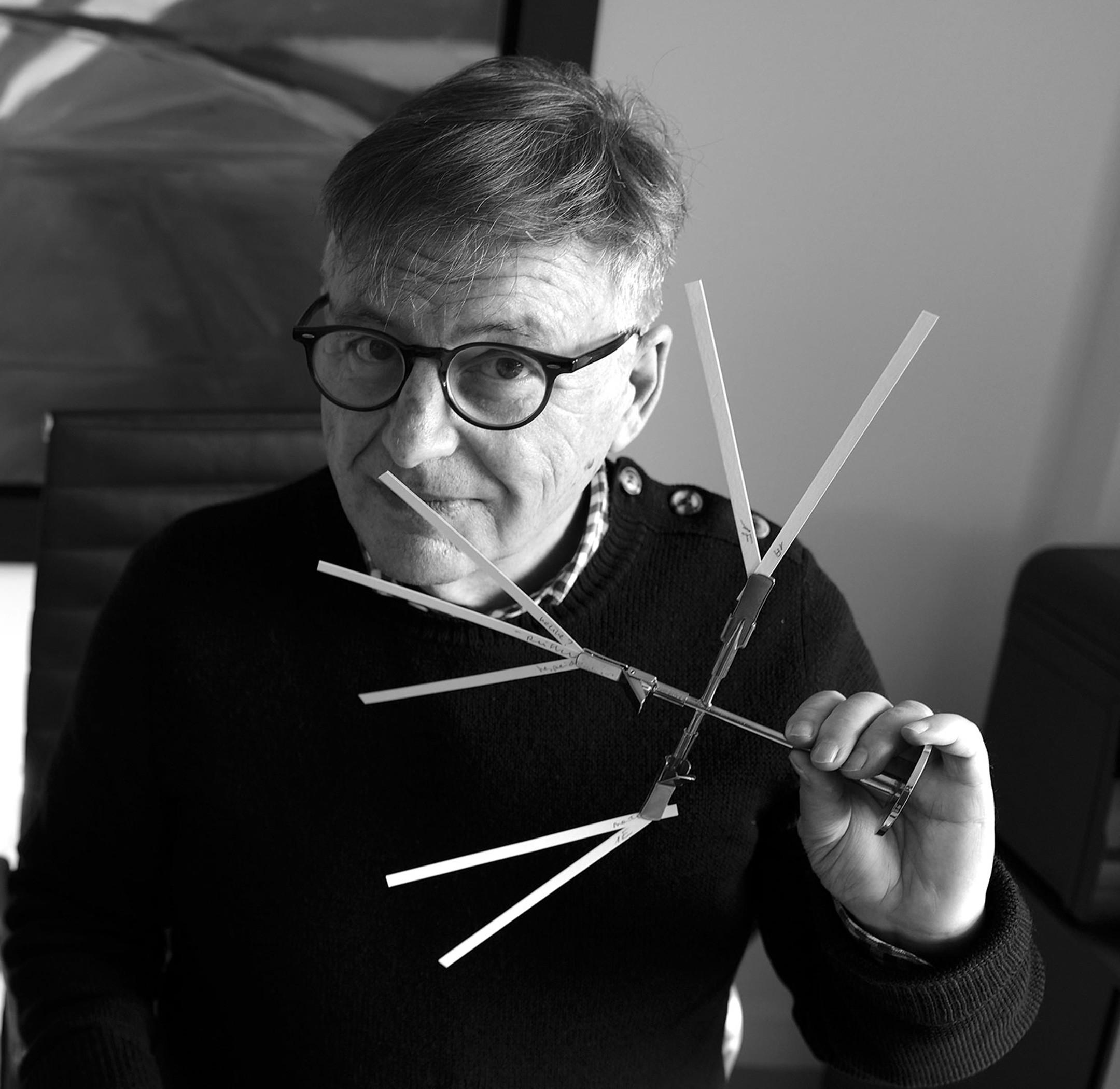 An image of Jacques Chabert holding Fragrance Sticks To his nose
