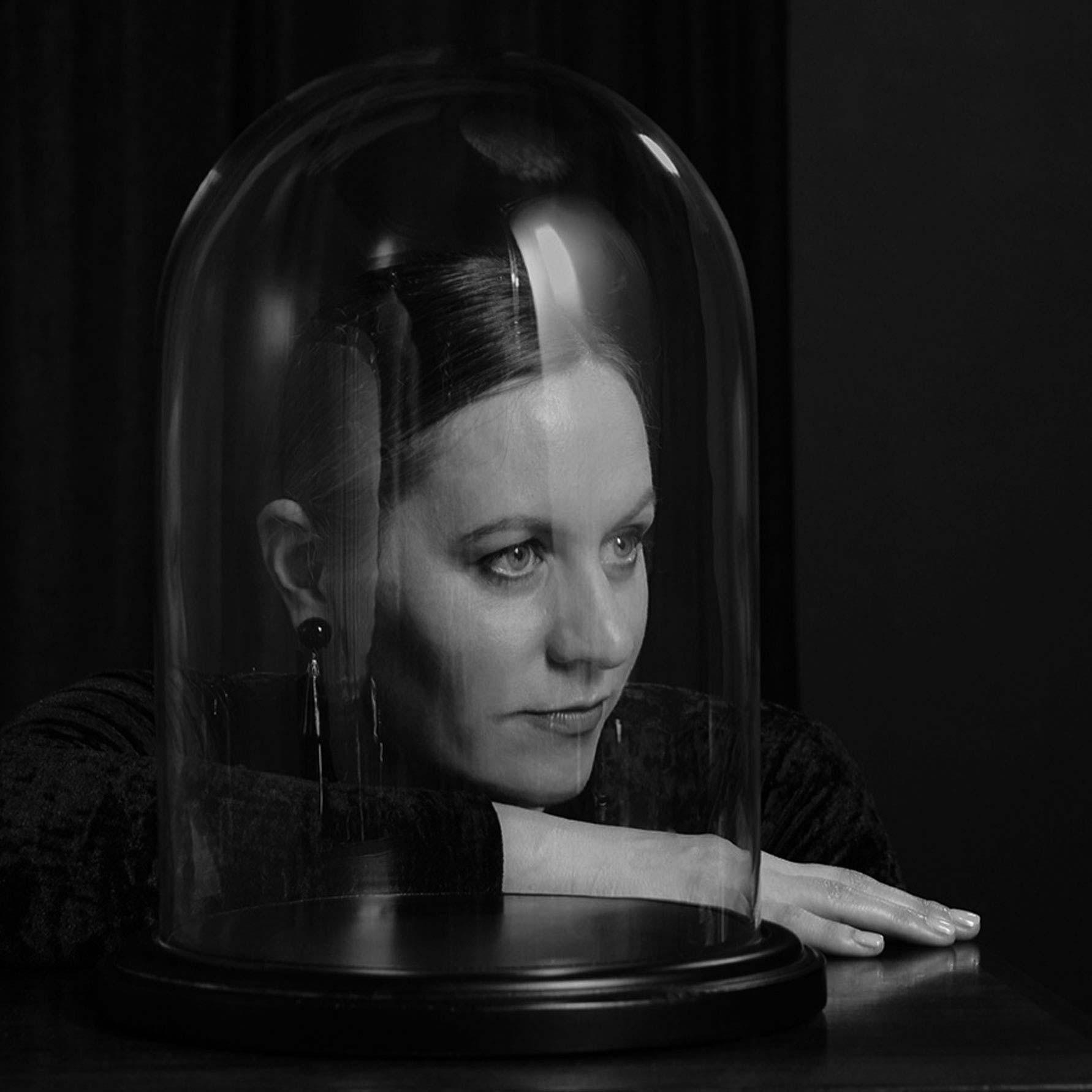 An image of Molton Brown Perfumer Julie Pluchet behind a glass piece