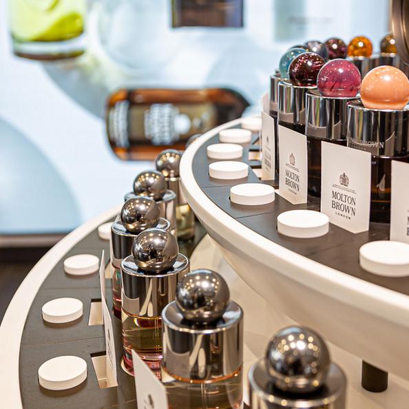 An image of Molton Brown Perfume Bottles on a shop display