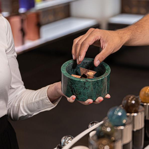 An Image of a customer choosing a hand massage fragrance
